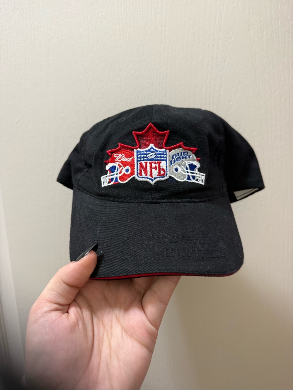 Vintage NFL Black Cap with Red and White Embroidered Crest